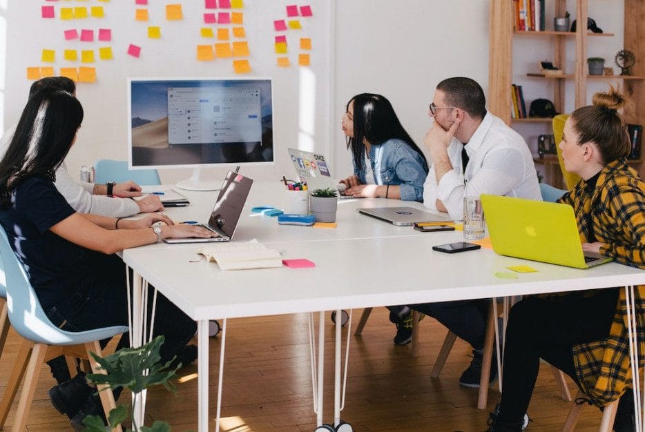 A group of people sitting around a table.