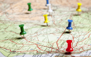 A map with pins on it and some of the pins are red.